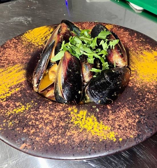 Spicy Sautéed Mussels with Naan.